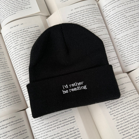 Black beanie with 'I'd rather be reading' text on an open book