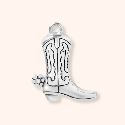 Silver cowboy boot charm on a white background